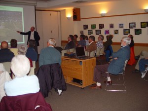 Mr Warn presents his historic photos to the group